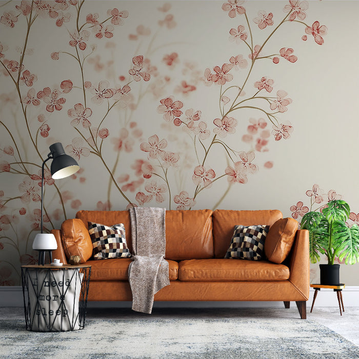Un salon chaleureux avec un papier peint floral aux teintes douces de rose et beige, créant une ambiance romantique et apaisante.