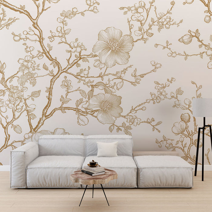 Une salon élégant avec un papier peint floral beige et doré, représentant des branches ornées de fleurs délicates, créant une atmosphère chaleureuse et raffinée.