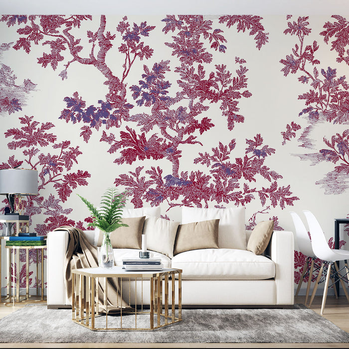 Un salon élégant avec un papier peint floral aux motifs de branches et feuilles en rouge et violet sur fond clair, créant une atmosphère chaleureuse et artistique.