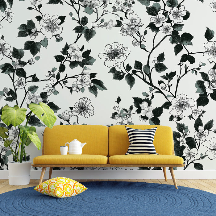 Un salon contemporain avec un papier peint floral noir et blanc représentant des fleurs et des feuilles, créant une atmosphère élégante et apaisante.