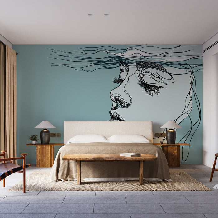 Une chambre moderne avec un papier peint artistique représentant un visage stylisé en noir sur un fond bleu apaisant, créant une ambiance sereine et contemplative.