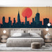 Une chambre moderne avec un papier peint représentant une silhouette urbaine stylisée au coucher de soleil, créant une ambiance dynamique et contemporaine.