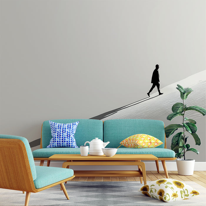Un salon moderne avec un papier peint minimaliste représentant une silhouette marchant sur un fond gris, créant une ambiance élégante et contemplative.