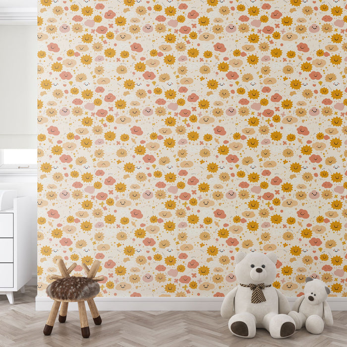 Une chambre d'enfant avec un papier peint ludique aux motifs de fleurs et de soleils souriants dans des teintes douces de rose et jaune, créant une ambiance joyeuse et chaleureuse.