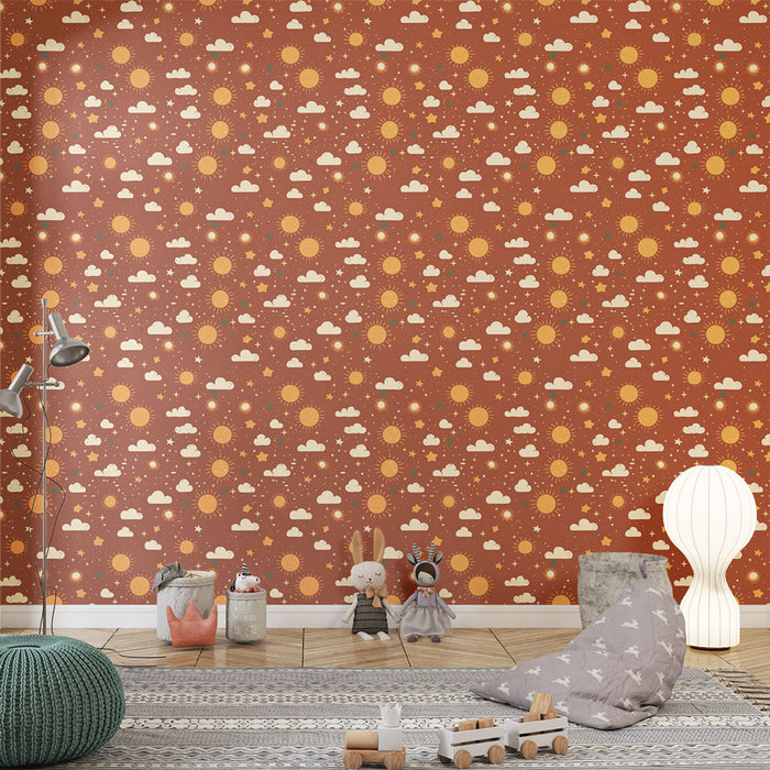 Une chambre d'enfant avec un papier peint ludique représentant des soleils, des nuages et des étoiles sur fond terracotta, créant une ambiance chaleureuse et joyeuse.