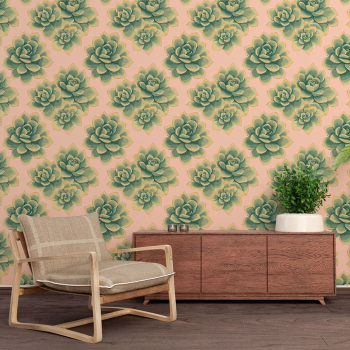 Une pièce moderne avec un papier peint floral représentant des succulentes vertes sur fond rose, créant une ambiance fraîche et accueillante.