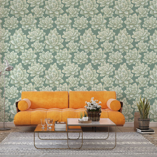 Un salon moderne avec un papier peint représentant des succulentes aux teintes douces sur fond vert, créant une atmosphère apaisante et naturelle.
