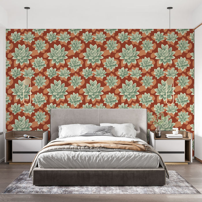 Une chambre moderne avec un papier peint floral aux motifs de succulentes vertes sur fond rouge orangé, créant une atmosphère chaleureuse et accueillante.