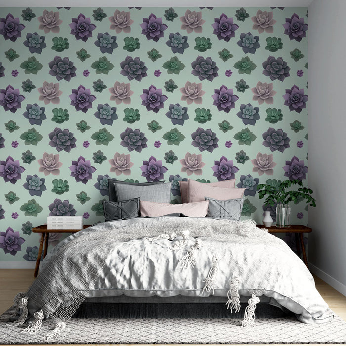 Une chambre élégante avec un papier peint floral représentant des succulentes aux teintes douces de vert, violet et rose sur fond clair, créant une atmosphère apaisante et naturelle.