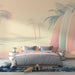 Une chambre moderne avec un papier peint tropical aux teintes pastel représentant des planches de surf et des palmiers, créant une ambiance estivale et relaxante.