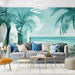 Un salon lumineux avec un papier peint tropical aux teintes turquoise illustrant des palmiers et des planches de surf, créant une ambiance estivale et relaxante.