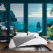 Une chambre moderne avec un papier peint tropical représentant des paysages marins stylisés en nuances de bleu et vert, créant une ambiance apaisante et rafraîchissante.