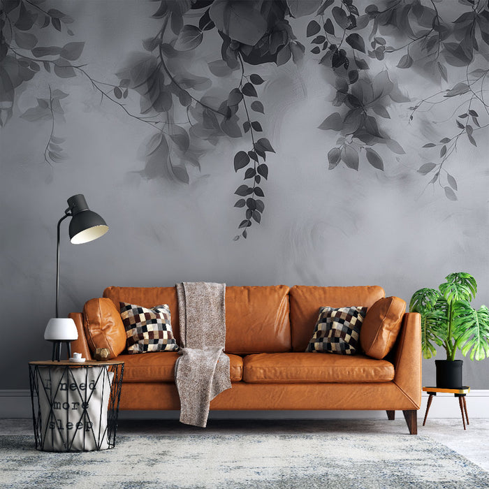 Un salon moderne avec un papier peint représentant des feuillages en nuances de gris, créant une ambiance élégante et apaisante.
