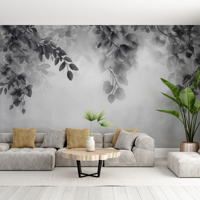 Un salon moderne avec un papier peint en dégradé de gris illustrant des feuilles délicates, créant une atmosphère apaisante et élégante.