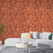 Un salon moderne avec un papier peint terracotta orné de toucans et de feuillages, créant une ambiance tropicale et chaleureuse.
