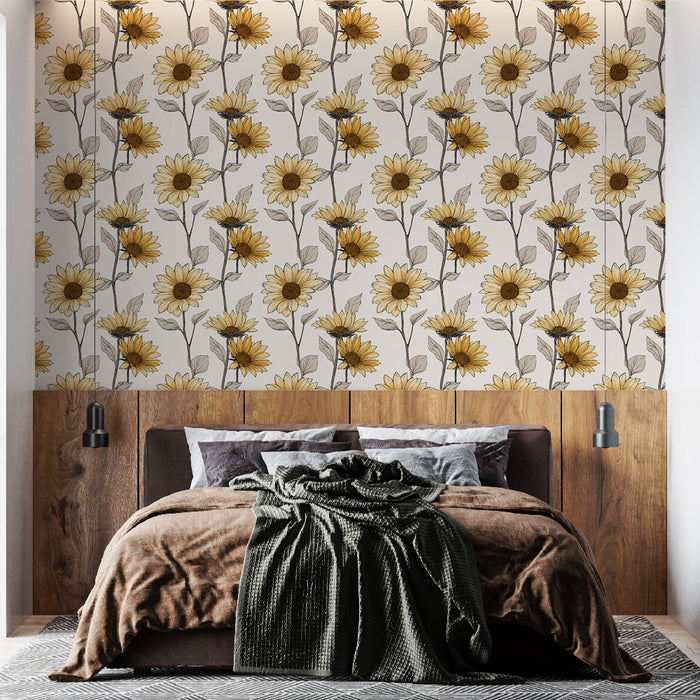 Une chambre chaleureuse avec un papier peint floral représentant des tournesols jaunes sur fond clair, créant une ambiance lumineuse et accueillante.