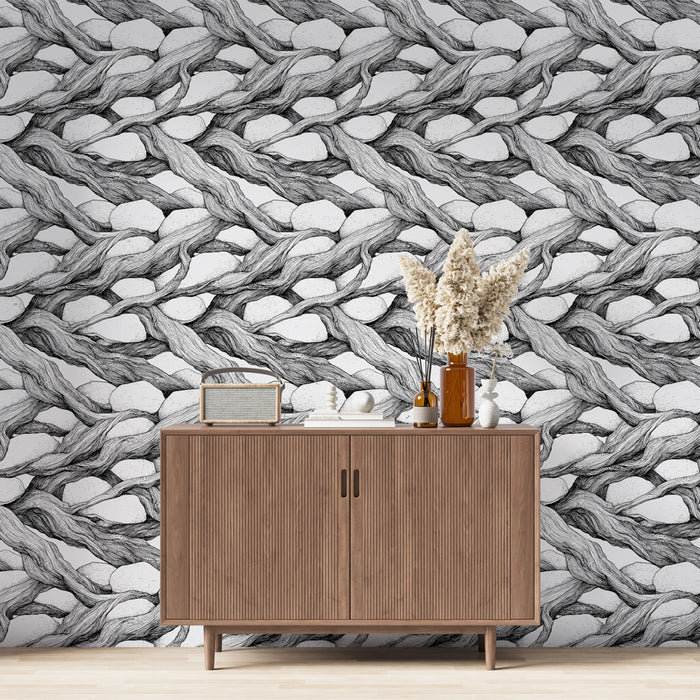 Une pièce moderne avec un papier peint en noir et blanc représentant des motifs entrelacés de branches et de pierres, créant une ambiance artistique et texturée.