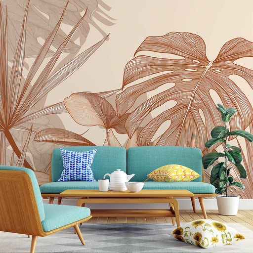 Un salon lumineux avec un papier peint représentant de grandes feuilles tropicales en lignes brunes sur fond beige, créant une ambiance chaleureuse et naturelle.