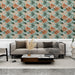 Un salon contemporain avec un papier peint tropical aux motifs de feuillage vert et orange sur fond clair, créant une atmosphère chaleureuse et accueillante.