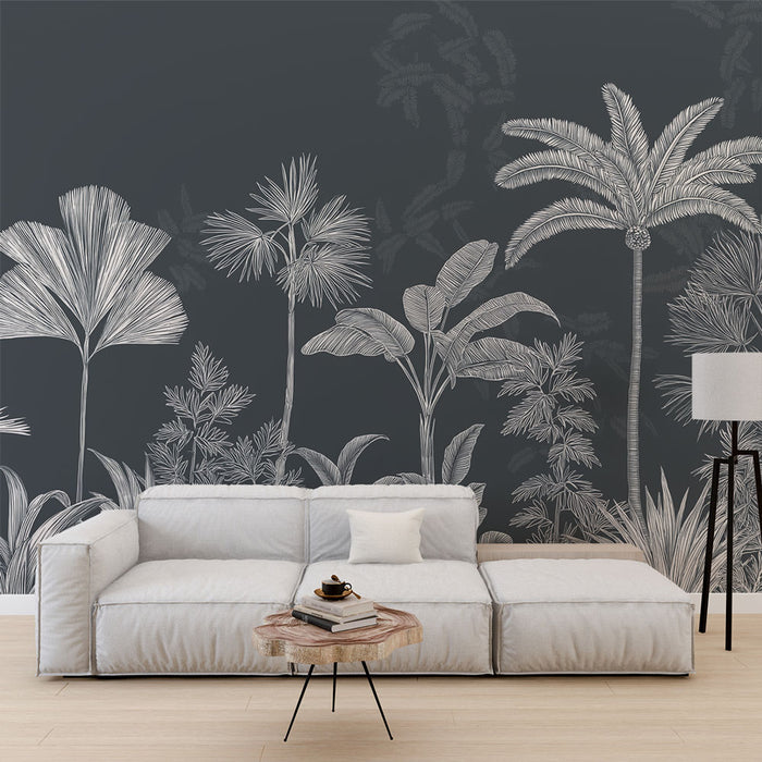 Un salon moderne avec un papier peint tropical noir illustrant des feuillages blancs, créant une ambiance élégante et apaisante.