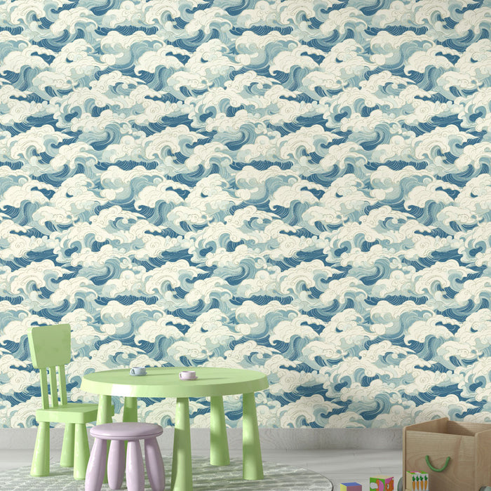 Une salle de jeux avec un papier peint représentant des vagues stylisées dans des nuances de bleu et blanc, créant une ambiance dynamique et apaisante.