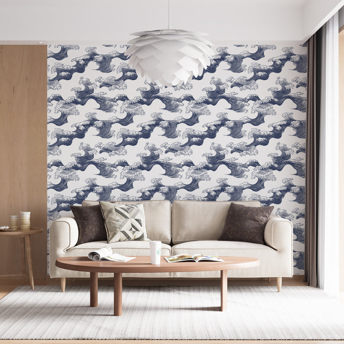 Un salon moderne avec un papier peint représentant des vagues stylisées en bleu sur fond blanc, créant une ambiance dynamique et apaisante.
