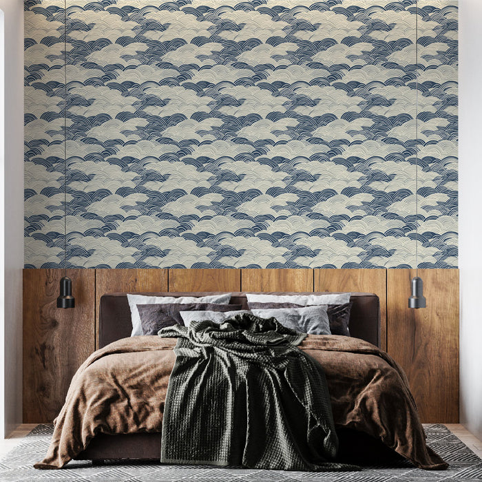 Une chambre moderne avec un papier peint aux motifs de vagues bleues sur fond clair, créant une atmosphère apaisante et élégante.