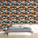 Une chambre moderne avec un papier peint aux motifs de vagues stylisées en noir, orange et crème, créant une ambiance dynamique et chaleureuse.