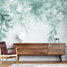 Une pièce moderne avec un papier peint floral aux teintes douces de vert et blanc, créant une atmosphère apaisante et naturelle.