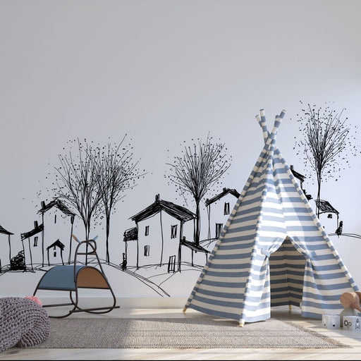 Une chambre d'enfant avec un papier peint illustratif représentant des maisons et des arbres en noir sur fond blanc, créant une ambiance ludique et chaleureuse.