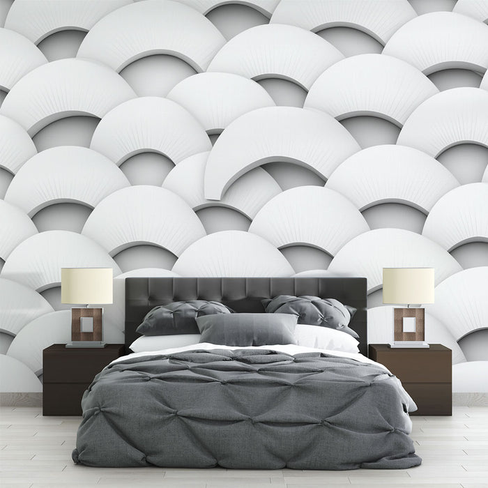 Une chambre moderne avec un papier peint texturé en motifs de demi-cercles blancs et gris créant une ambiance élégante et apaisante.