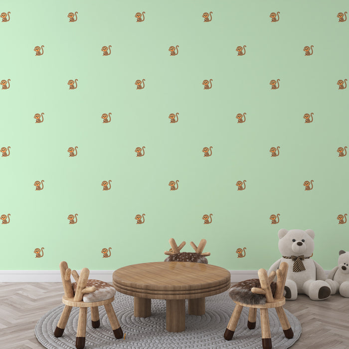 Papier peint vert clair avec petits singes pour chambre d'enfant, décoration ludique et colorée.
